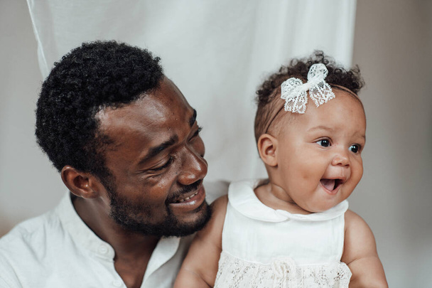 happy black man with his daughter - Photo, image