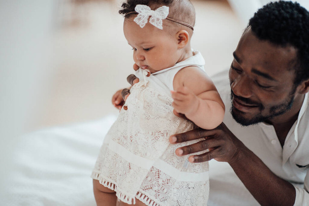 african american man with his daughter at home - Φωτογραφία, εικόνα