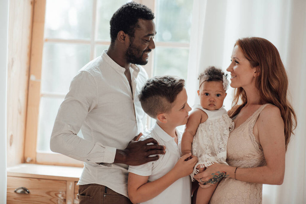 portrait of happy interracial family with daughter and son - Foto, afbeelding