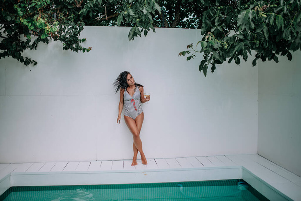 sexy girl in swimming suit near pool  - Fotó, kép