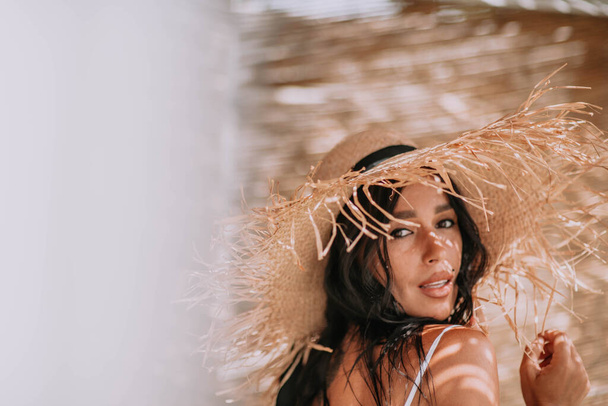 female model in straw hat closeup portrait  - Фото, изображение