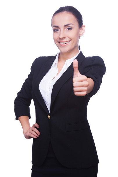 Woman in formalwear showing her thumb up - Фото, изображение