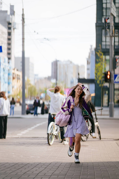 Pretty young woman, walking at the street. - Foto, Bild