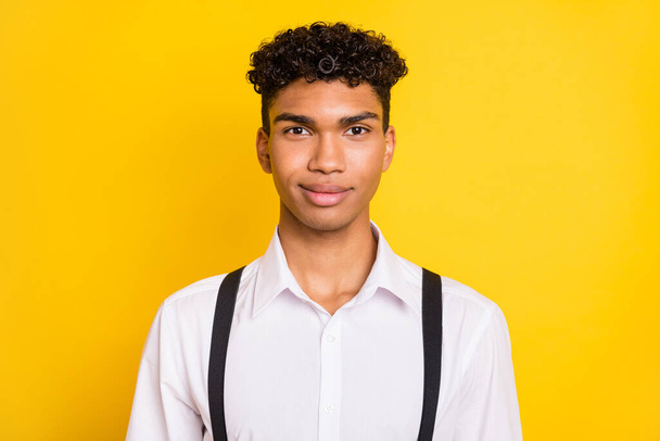 Photo portrait of african american guy smiling isolated on vivid yellow colored background - Foto, afbeelding