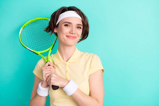 Portrait of nice cute confident sportive cheery girl holding in hand racket isolated over bright teal turquoise color background - Fotografie, Obrázek