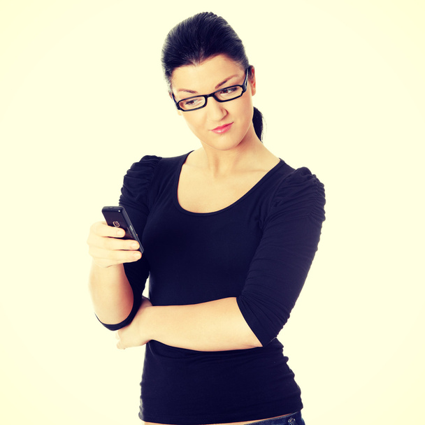 Young woman using cell phone - Φωτογραφία, εικόνα