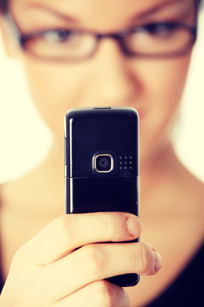 Young woman using cell phone - Photo, Image