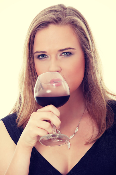 Elegant woman with glass red wine - 写真・画像