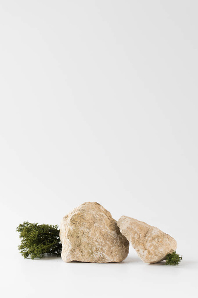 A podium made of gray stones, moss for the presentation of your product. Modern display of goods - Fotoğraf, Görsel