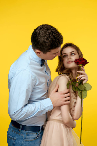 man and woman flower romance relationship yellow background - Foto, Imagem
