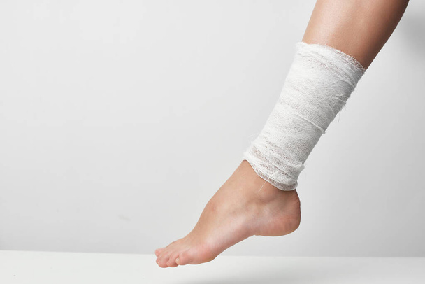 bandaged leg traumatology health problems close-up - Fotografie, Obrázek