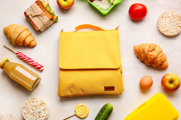 Lunch box bag and food on light background - Photo, Image