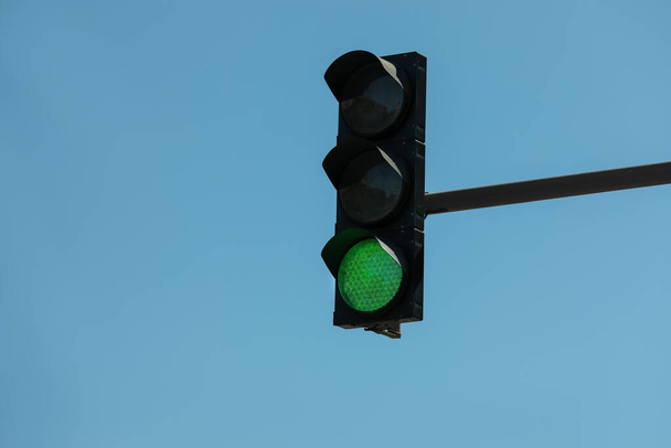 View of traffic light against blue sky - Φωτογραφία, εικόνα