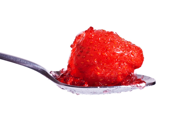 Strawberry jelly on spoon - Fotoğraf, Görsel