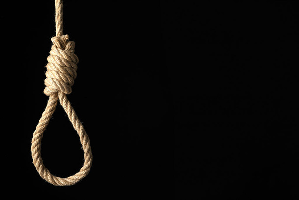 Rope noose with knot on black background, space for text - Фото, изображение