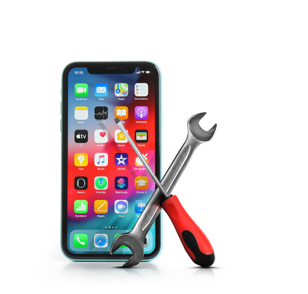 MYKOLAIV, UKRAINE - JULY 9, 2020: iPhone 11 with home screen on white background. Repairing service  - Photo, image