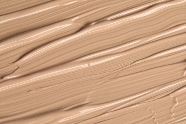 Texture of liquid skin foundation as background, closeup - Fotó, kép
