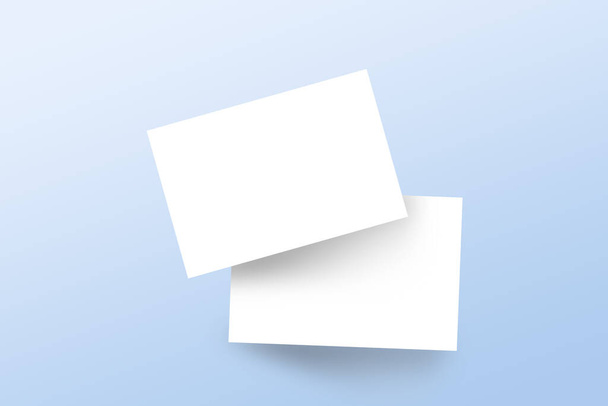 Plantilla realista de tarjetas de visita de marca de maqueta con sombra sobre fondo azul claro. Piso tendido, vista superior. - Foto, imagen