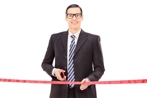 Businessman cutting red tape - Foto, immagini