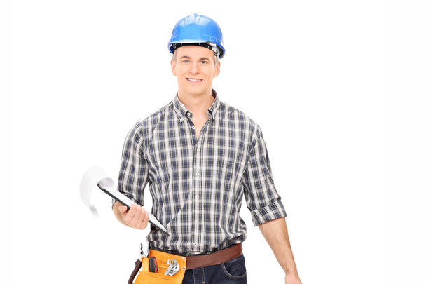 Engineer holding clipboard - Foto, afbeelding