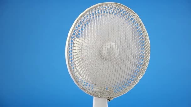 rotating retro fan ventilator in center of blue screen background, vintage electrical conditioning and air cooling, front view - Footage, Video