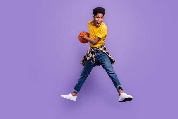 Full length body size view of attractive cheery lucky guy jumping playing game having fun isolated over violet purple color background - Fotó, kép