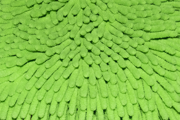 Close-up van getextureerde lichtgroene microvezel tapijt - Foto, afbeelding