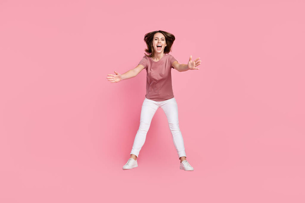 Full length body size view of attractive cheerful girl jumping hugging you having fun isolated over pink pastel color background - Fotoğraf, Görsel
