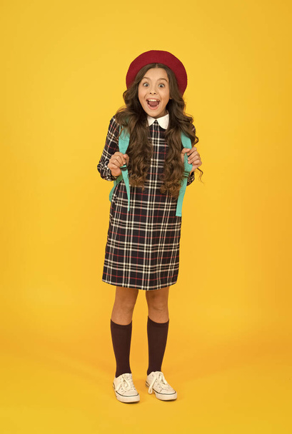 oh my god. school and fashion. child in pupil uniform. kid in french beret on yellow background. stylish teen college student. little girl with backpack going to school. education concept - Zdjęcie, obraz