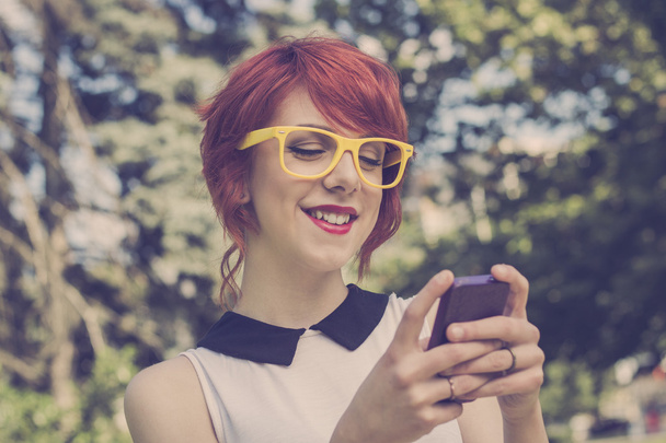 Cute hipster girl text messaging. Retro tones - Photo, Image