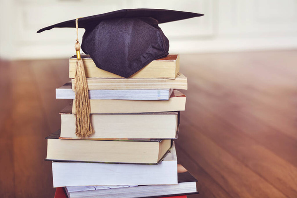Black Graduation Hat with Books .Education Concept - Foto, immagini