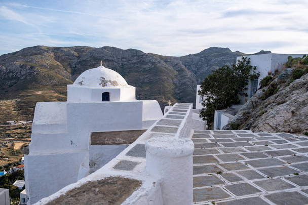 Church orthodox, small whitewashed old chapel, climbed on rocky mountain at Serifos island, Cyclades Greece. Religious destination vacation summer - Fotografie, Obrázek