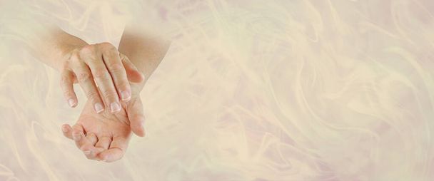 Humble Healing Hands Message Banner - female hands on left side emerging from pale misty gold flowing background with plenty of copy space - Photo, Image