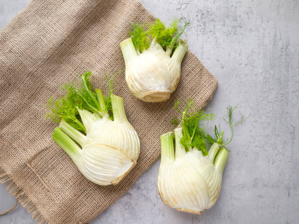 Top view of three fresh fennel bulb. Delicious and healthy food ingredients. - Фото, изображение