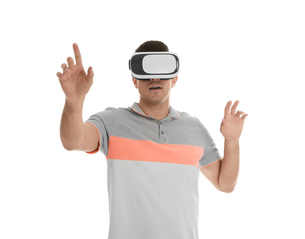 Man using virtual reality headset on white background - Photo, Image