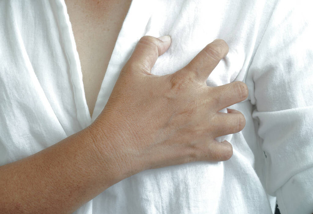 woman having heart attack chest pain. - Zdjęcie, obraz