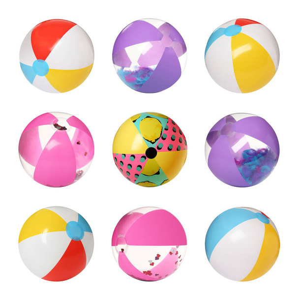 Set with different inflatable beach balls on white background - Foto, Imagen