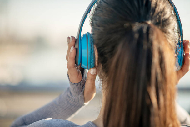 Close up of a girls head in headphones - Zdjęcie, obraz