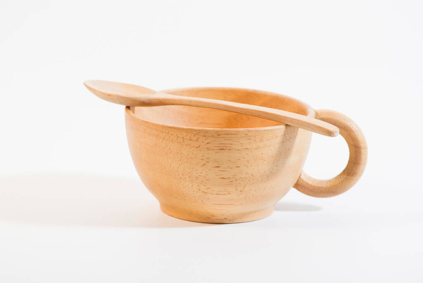 wooden cup with wooden spoon on white background Only the point is clear - Fotografie, Obrázek