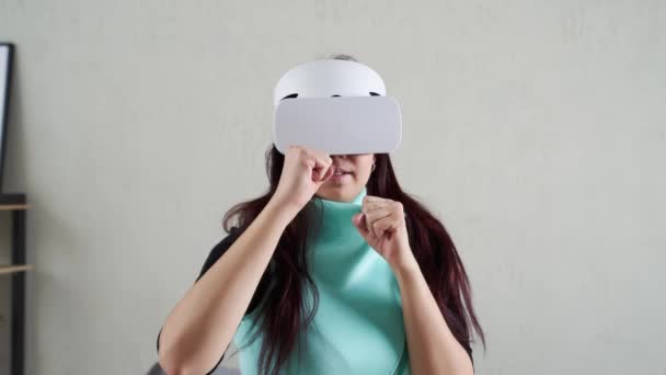 Woman is using virtual reality headset. - Footage, Video