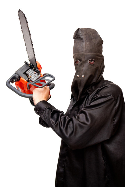 Butcher in the black leather mask is holding chainsaw. Isolated on white. - Fotó, kép