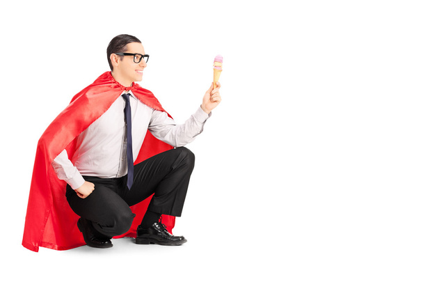 Male superhero holding ice cream - 写真・画像