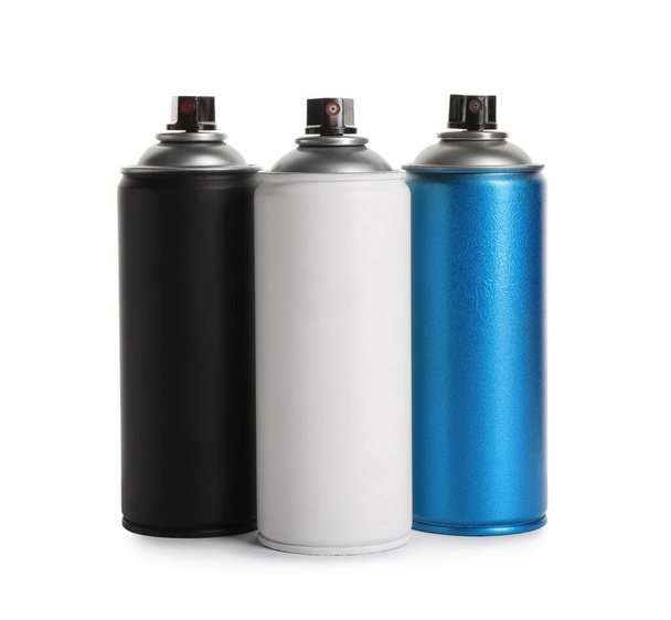 Cans of different spray paints on white background. Graffiti supplies - Foto, Imagen