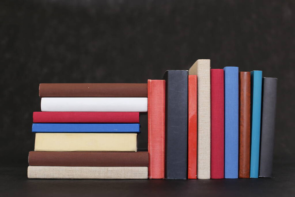  Stack of books on black background - Фото, изображение