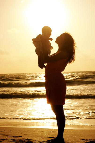 Silhouette of mother and baby - Photo, Image