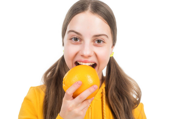 healthy life. diet and kid skin beauty. happy teen girl with orange citrus fruit. - Fotó, kép