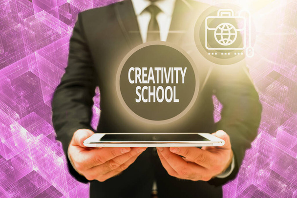 Sign displaying Creativity School. Word for students are able to use imagination and critical thinking Man In Office Uniform Holding Tablet Displaying New Modern Technology. - Zdjęcie, obraz