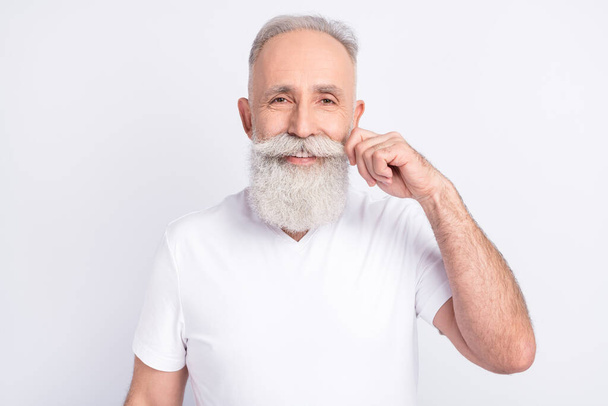 Photo of positive happy charming old man good mood adjust mustache smile isolated on grey color background - Fotoğraf, Görsel