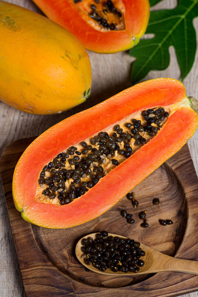 Fresh, sweet and delicious papaya on a wooden table - Φωτογραφία, εικόνα