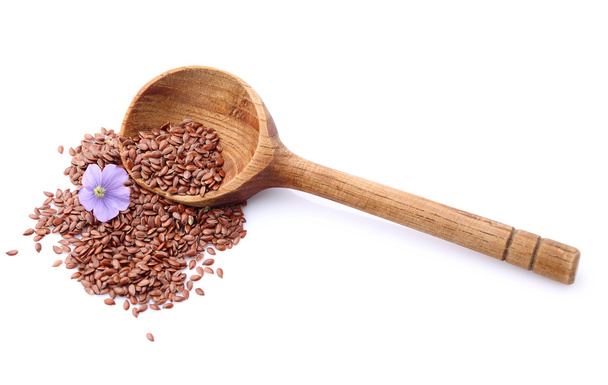 Flax seeds with wooden spoon - Foto, immagini